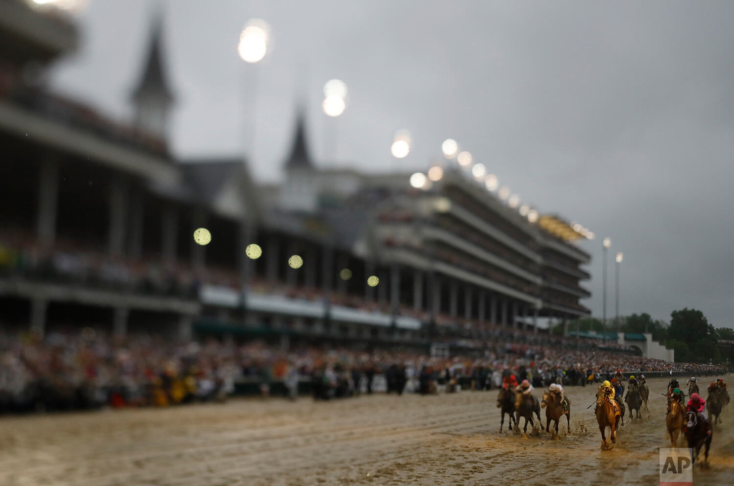  In this photo made with a tilt shift lens, Luis Saez rides Maximum Security across the finish line first during the 145th running of the Kentucky Derby horse race at Churchill Downs on May 4, 2019 in Louisville, Ky. Country House was declared the wi