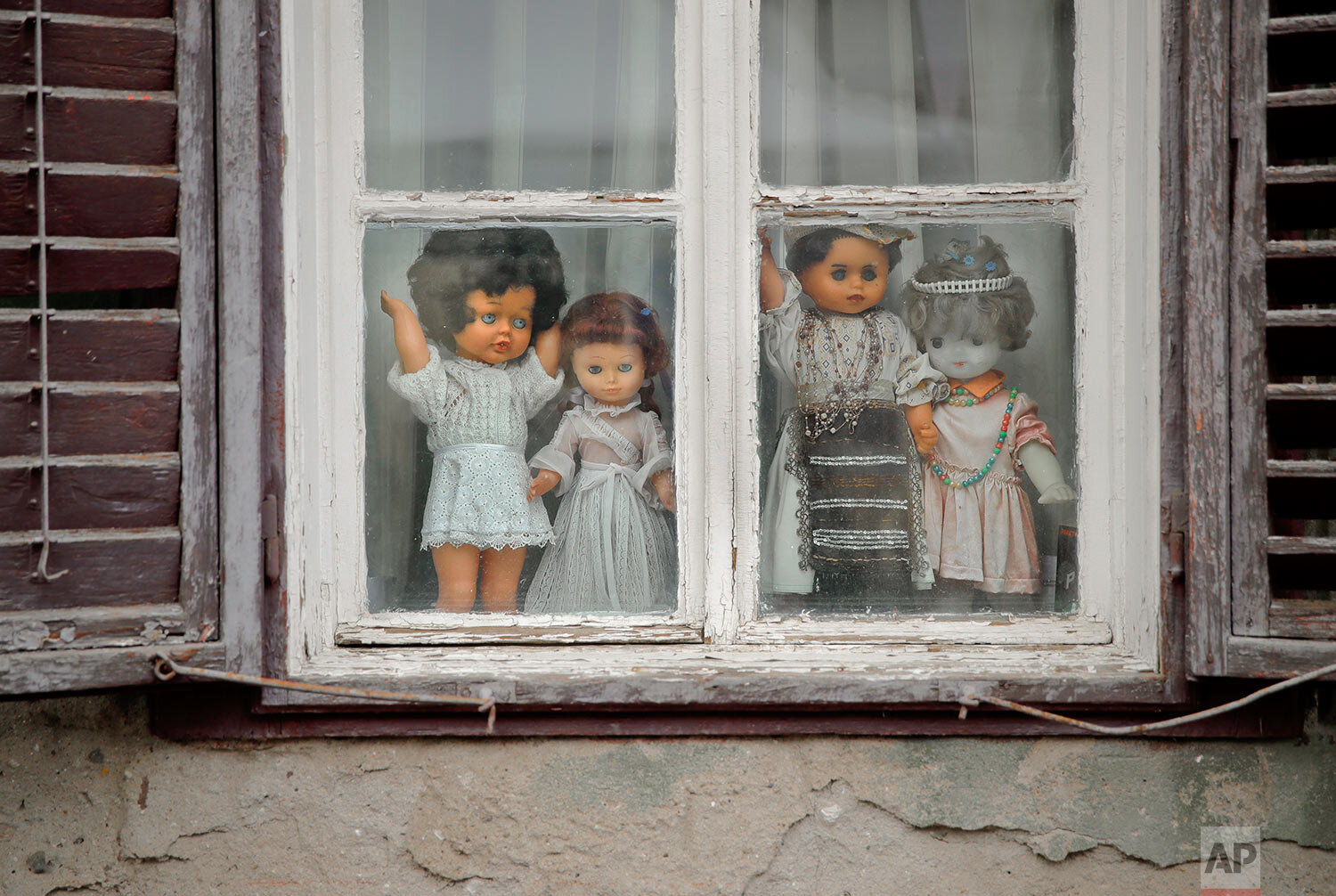  Dolls decorate a window in the old part of the Transylvanian town of Sibiu, Romania, on May 10, 2019. (AP Photo/Vadim Ghirda) 