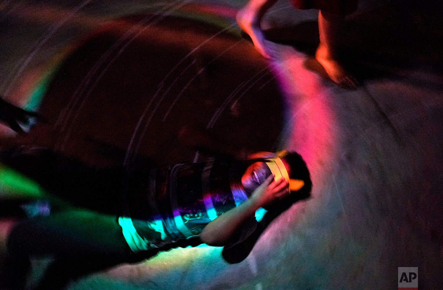  Byron Xol, an immigrant from Guatemala, lies on the floor in a make-shift disco ballroom in Buda, Texas, during his birthday party on June 23, 2019. Byron was separated from his father, David Xol-Cholom, in May 2018, during the Trump administration'