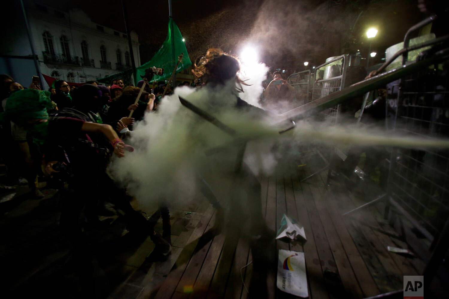  Women clash with police after lawmakers did not approve a law that decriminalizes abortion in cases of rape, outside the National Assembly in Quito, Ecuador, on Sept. 17, 2019. (AP Photo/Dolores Ochoa) 