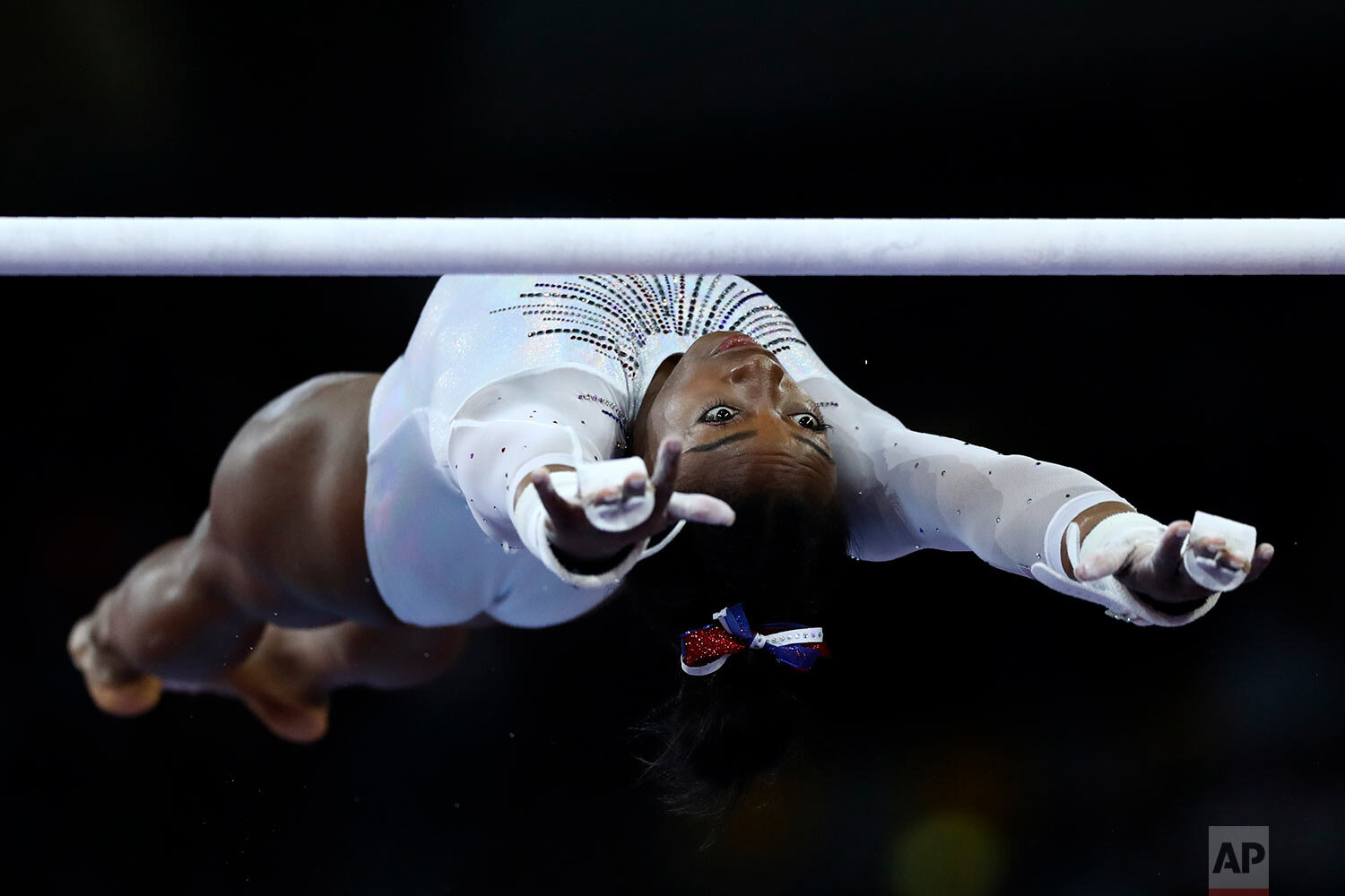  Simone Biles of the United States performs on the uneven bars during a warmup for the women's all-around final at the Gymnastics World Championships in Stuttgart, Germany, on Oct. 10, 2019. (AP Photo/Matthias Schrader) 