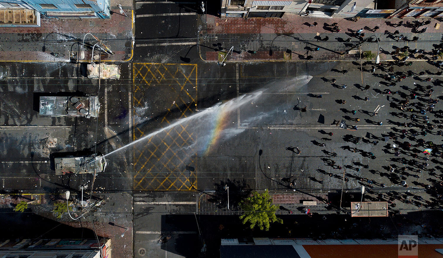  A police water cannon sprays anti-government demonstrators in Valparaiso, Chile, on Oct. 26, 2019. (AP Photo/Matias Delacroix) 