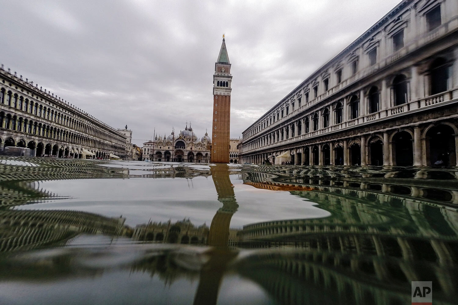  St. Mark's Square in Venice, Italy, is flooded at high tide on Nov. 15, 2019, just three days after the lagoon city experienced its worst flooding in more than 50 years. (AP Photo/Luca Bruno) 