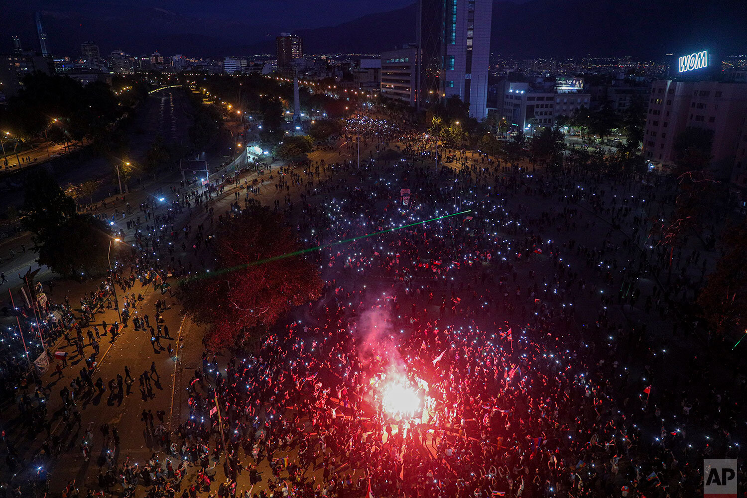  People gather for an anti-government protest in Santiago, Chile, Friday, Nov. 1, 2019. Groups of Chileans continued to demonstrate as government and opposition leaders debate the response to nearly two weeks of protests that have paralyzed much of t