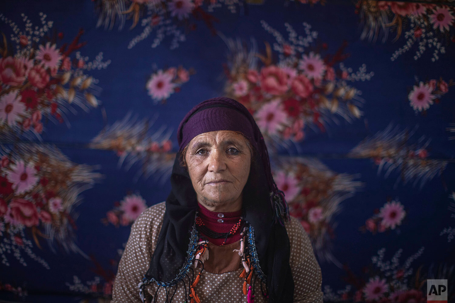  In this Tuesday, Nov. 5, 2019 photo, Biya Idbouali, 60, a villager who is part of a women Saffron cooperative, poses for a portrait during harvest season in Askaoun, a small village near Taliouine, in Morocco's Middle Atlas Mountains. Morocco is amo