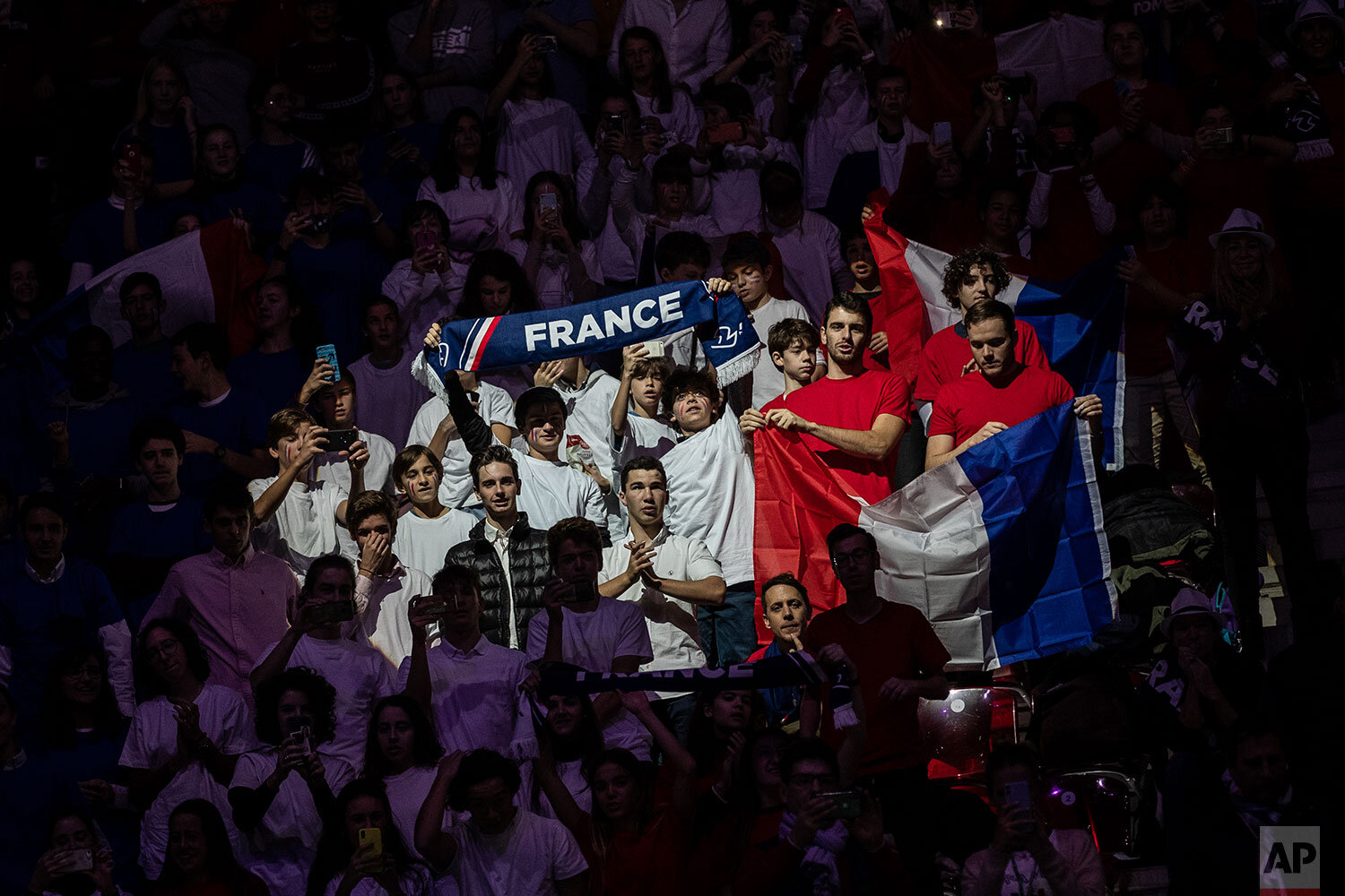  France supporters cheer during the Davis Cup tennis match between  Jo-Wilfried Tsonga and Serbia's Filip Krajinovic in Madrid, Spain, Thursday, Nov. 21, 2019. (AP Photo/Bernat Armangue) 