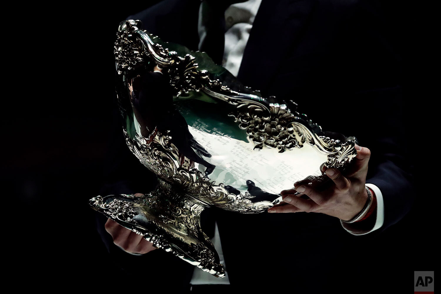  The trophy is brought to the court for the awards ceremony after Spain defeated Canada 2-0 to win the Davis Cup final in Madrid, Spain, Sunday, Nov. 24, 2019. (AP Photo/Manu Fernandez) 