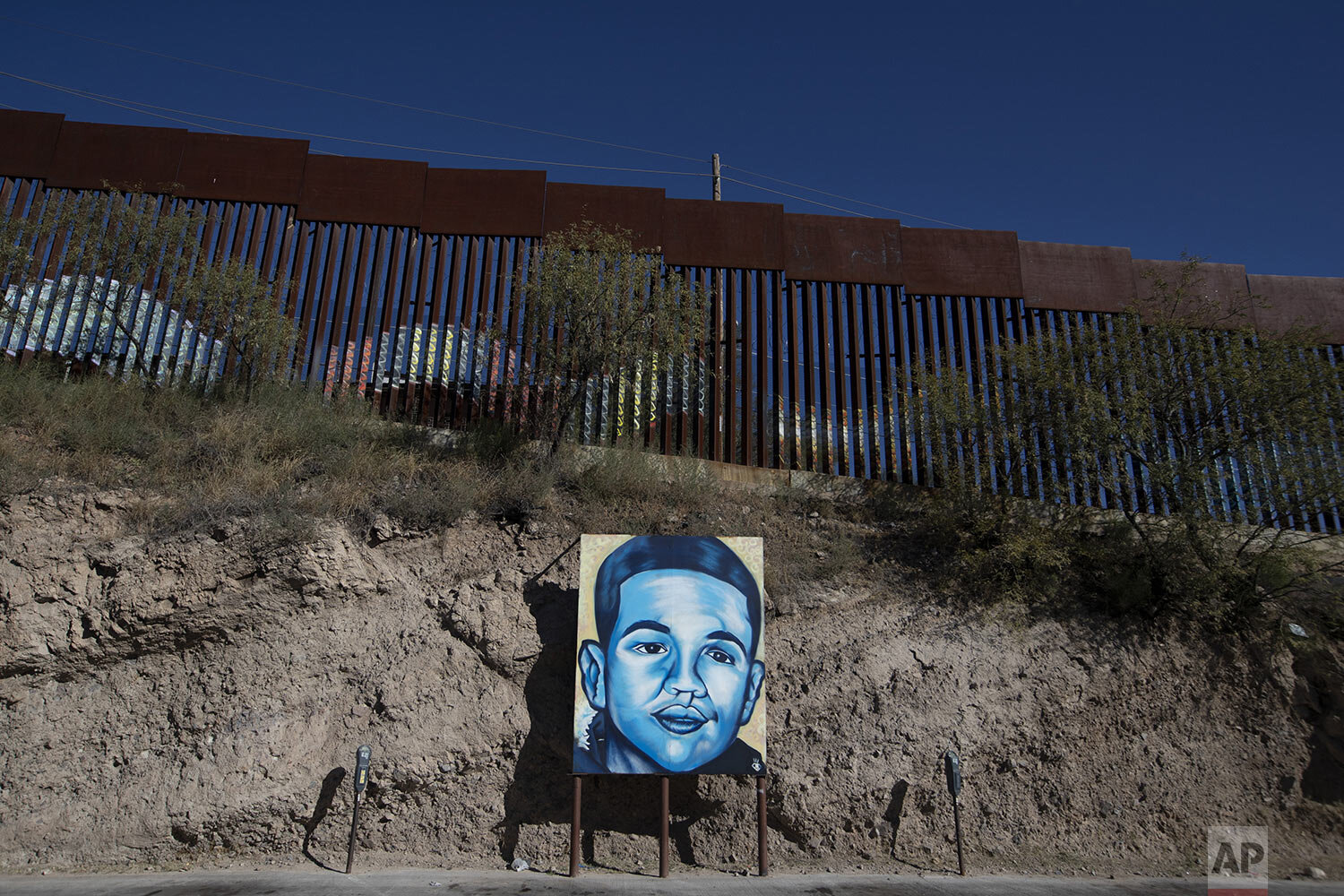  In this Oct. 31, 2019 photo, a portrait of 16-year-old Mexican youth Jose Antonio Elena Rodriguez, who was shot and killed by a U.S. Border Patrol agent, is displayed on the street where he was killed, on the U.S. border in Nogales, Sonora state, Me