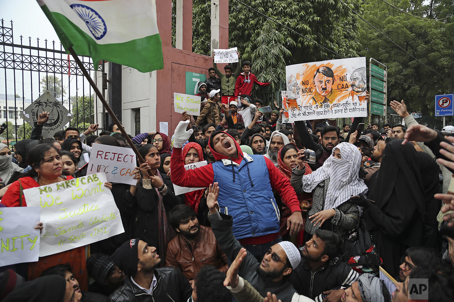  Indian students of the Jamia Millia Islamia University shout slogans during a protest, in New Delhi, India, Tuesday, Dec. 17, 2019. (AP Photo/Altaf Qadri) 