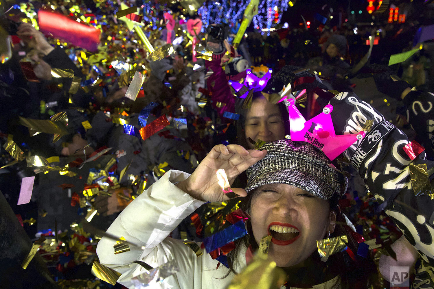 People celebrate the arrival of the year 2020 at a New Year's Eve countdown event near the 2022 Beijing Winter Olympic headquarters in Bejing, Wednesday, Jan. 1, 2020.  (AP Photo/Ng Han Guan) 