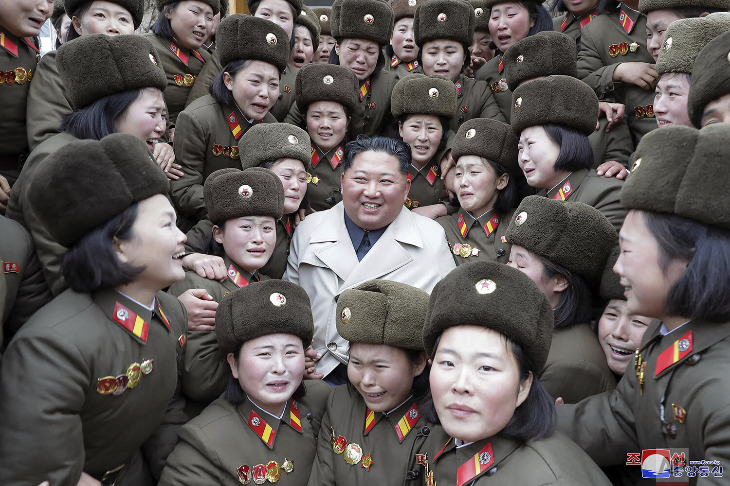  In this undated photo provided on Monday, Nov. 25, 2019, by the North Korean government, North Korean leader Kim Jong Un, center, poses as he inspects a women's company under Unit 5492 of the Korean People's Army in North Korea. (Korean Central News