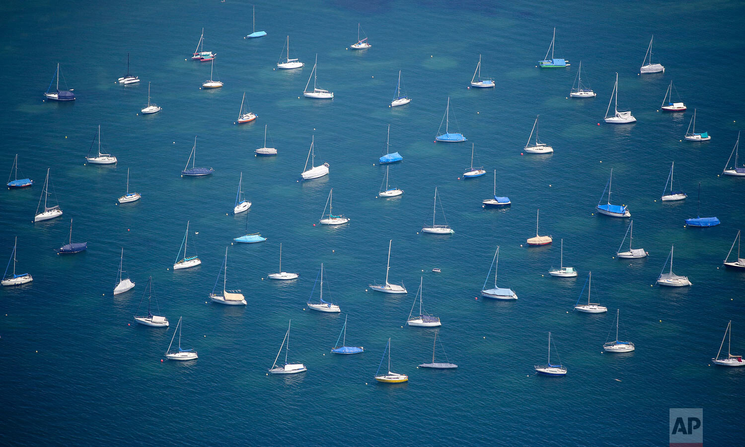  Sailing boats are anchored in Lake Bodensee in Konstanz, Germany, Friday, June 28, 2019. (Thomas Warnack/dpa via AP) 