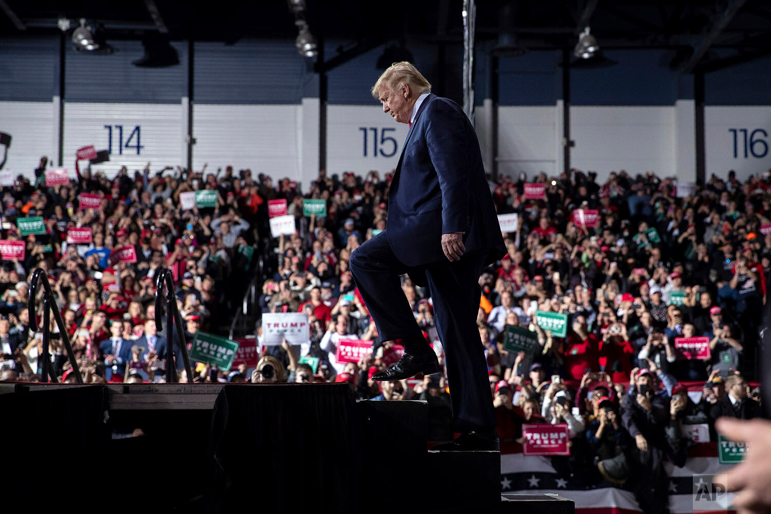  President Donald Trump arrives at W.K. Kellogg Airport to attend a campaign rally, Wednesday, Dec. 18, 2019, in Battle Creek, Mich., on the same day the House of Representatives voted to impeach him. (AP Photo/ Evan Vucci) 