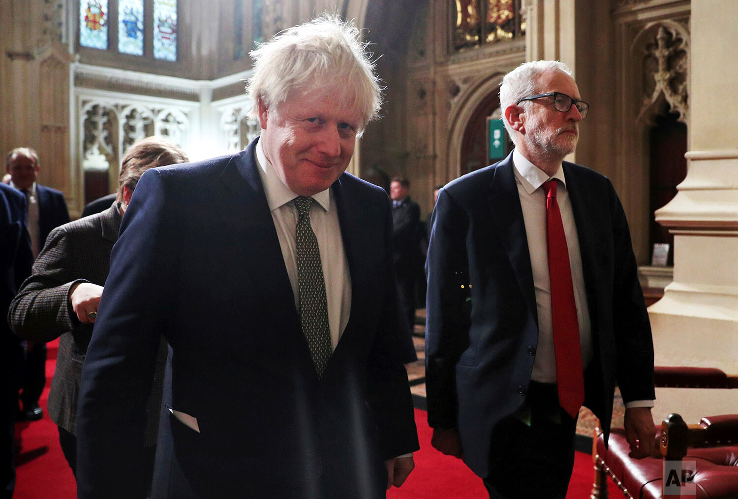  Prime Minister Boris Johnson, foreground, and Labour Party leader Jeremy Corbyn arrive for the State Opening of Parliament at the Houses of Parliament in London, Thursday, Dec. 19, 2019. Britain's Queen Elizabeth II formally opened a new session of 