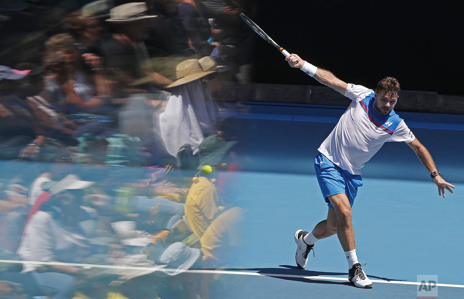  Switzerland's Stan Wawrinka makes a backhand return to Damir Dzumhur of Bosnia and Herzegovina during their first round singles match at the Australian Open tennis championship in Melbourne, Australia, Tuesday, Jan. 21, 2020. (AP Photo/Andy Wong) 