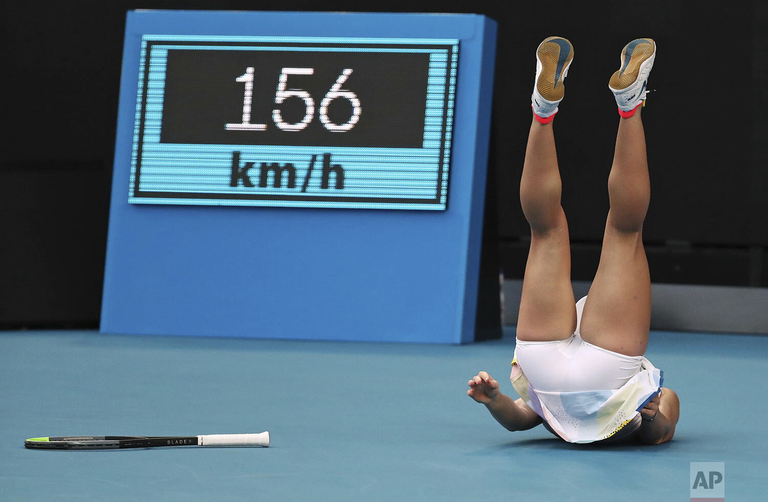  Romania's Simona Halep falls during her first round match against Jennifer Brady of the U.S. at the Australian Open tennis championship in Melbourne, Australia, Tuesday, Jan. 21, 2020. (AP Photo/Dita Alangkara) 