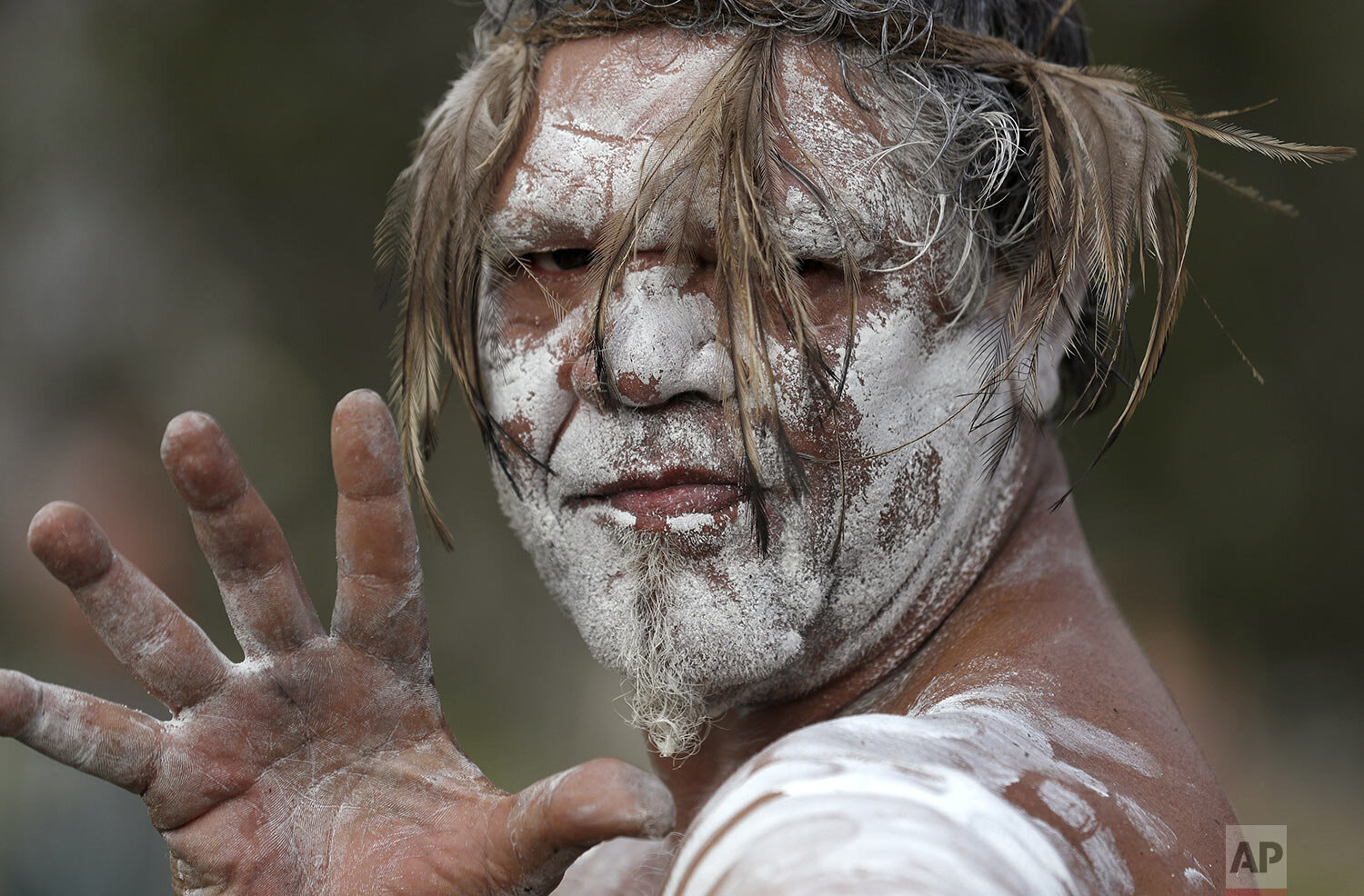  An Aboriginal man Anthony Kemp poses during the Wugulora Indigenous Morning Ceremony as part of Australia Day celebrations in Sydney, Sunday, Jan. 26, 2020. (AP Photo/Rick Rycroft) 
