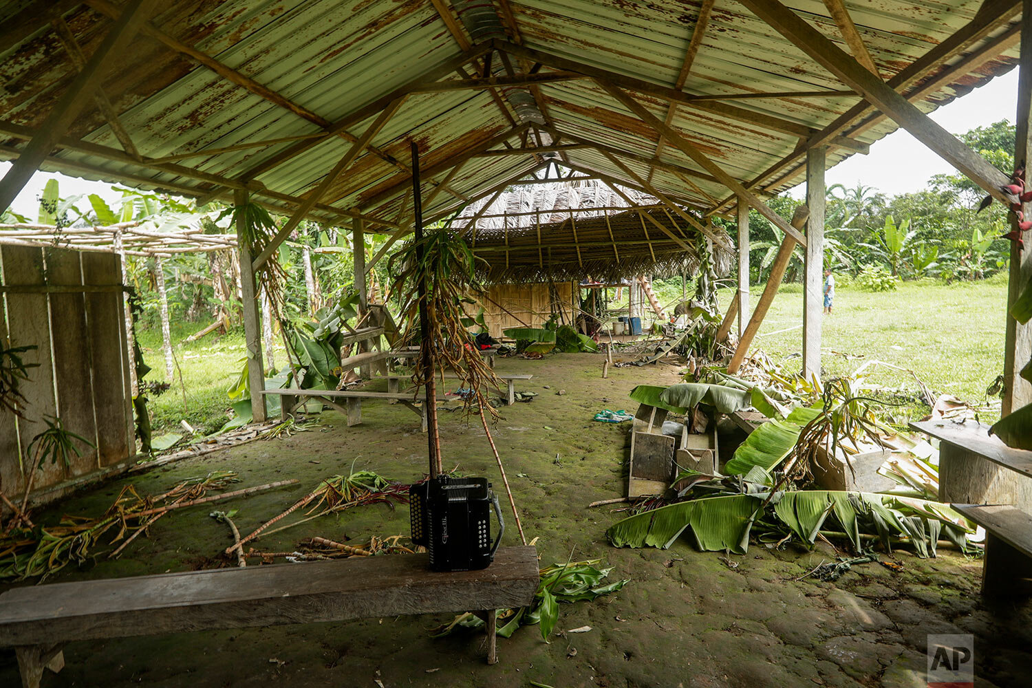  An accordion is on a bench inside the improvised temple where a pregnant woman, five of her children and a neighbor were killed by cult members in the remote hamlet of El Terron, Panama, Friday, Jan. 17, 2020. (AP Photo/Arnulfo Franco) 