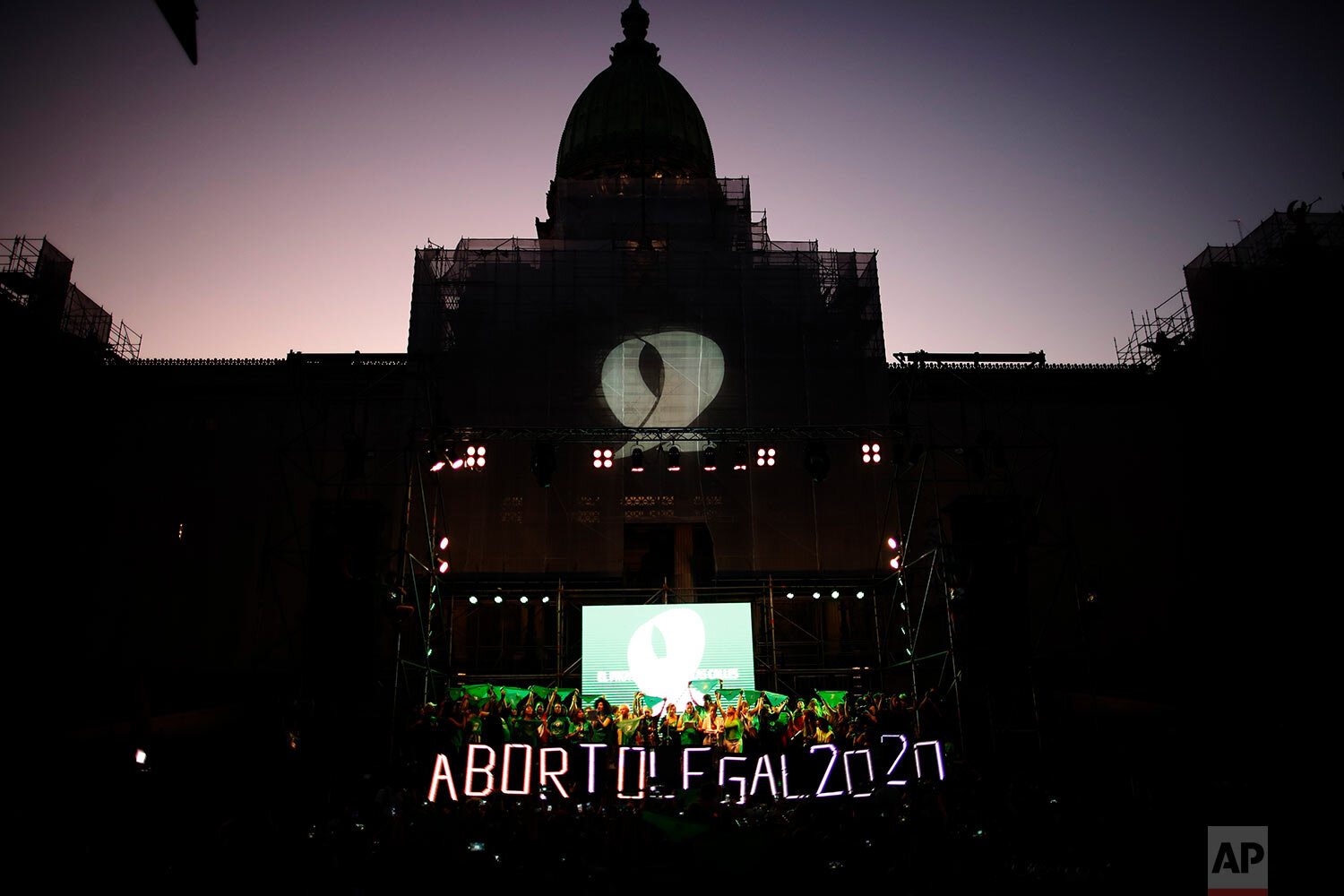  Abortion-rights activists, including feminist groups from the U.S. and Chile, demonstrate in favor of decriminalizing abortion, outside Congress in Buenos Aires, Argentina, Wednesday, Feb. 19, 2020. (AP Photo/Natacha Pisarenko) 