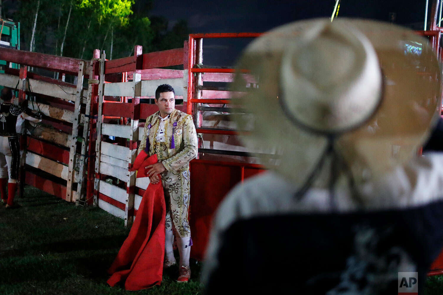  Antonio Gomez waits for the bull to enters the enclosure during a bullfight festival in Santa Elena, Paraguay, Saturday, Feb. 8, 2020. (AP Photo/Jorge Saenz) 