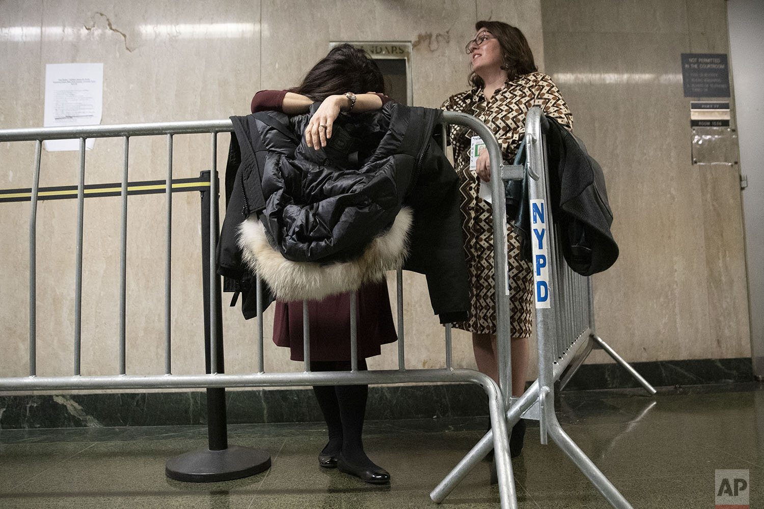  NBC News field producer Sumiko Moots, left, and wait in line to enter the courtroom during Harvey Weinstein’s rape trial, Wednesday, Feb. 19, 2020, in New York. (AP Photo/Mary Altaffer) 