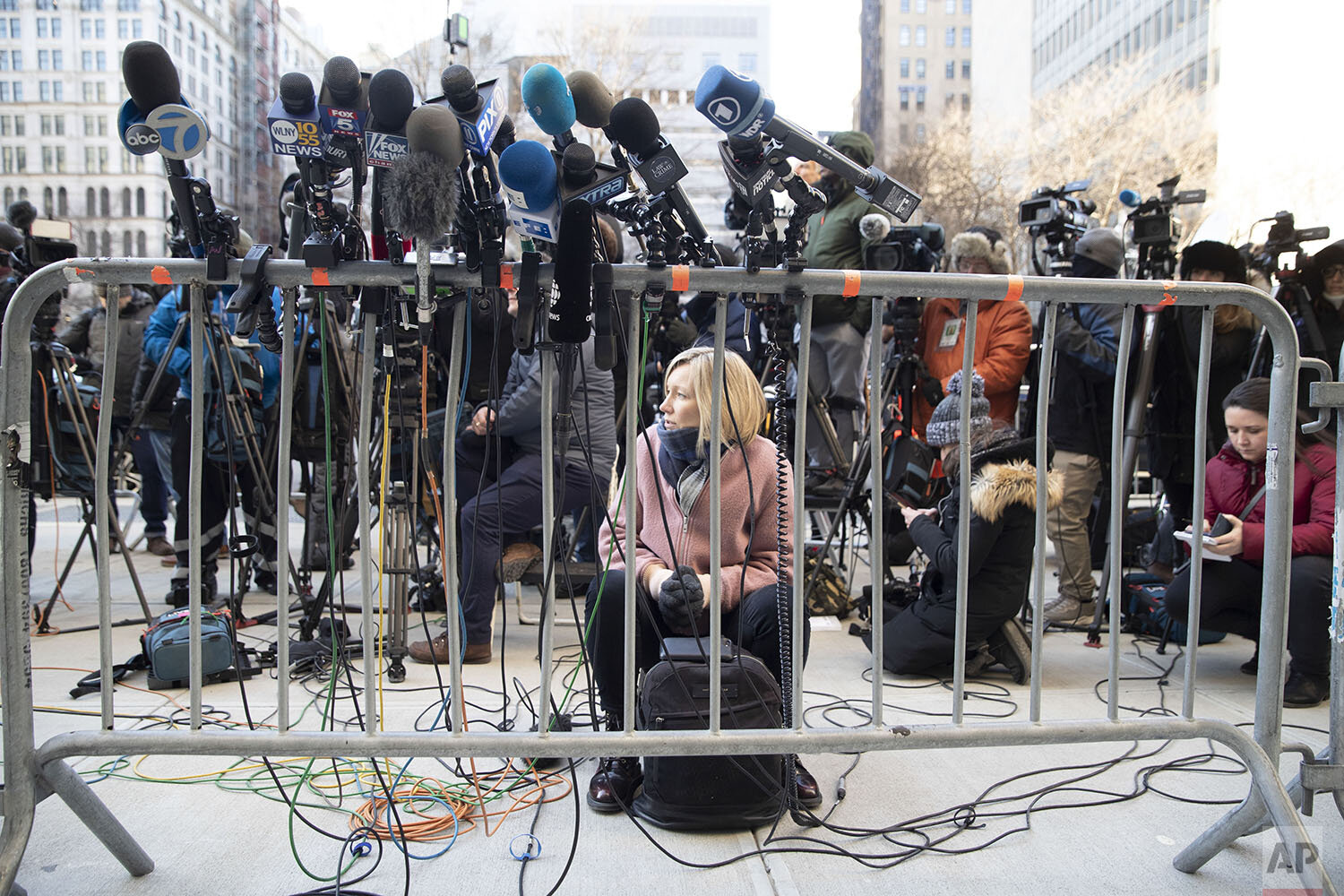  A reporter waits for lawyers to come address the media after Harvey Weinstein left court for the day during jury deliberations in his rape trial, Friday, Feb. 21, 2020, in New York. (AP Photo/Mary Altaffer) 