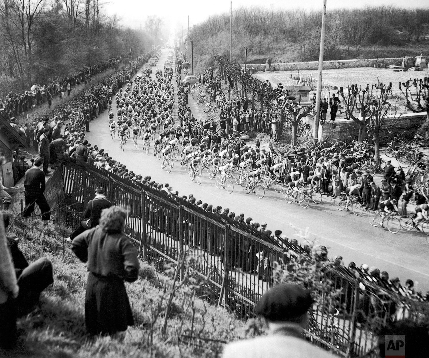  Rik van Steenbergen of Belgium beat Italy's Fausto Coppi by two lengths over the line in winning the 50th annual Paris-Roubaix road race on April 13, 1952. General view of the field bunched on the Ecouen Climb near Paris, France just after the start