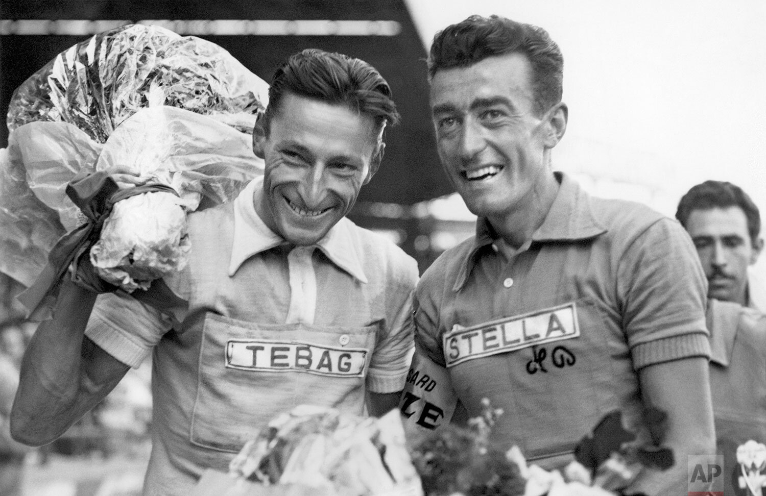  Winner of the Tour de France 1954, Louison Bobet from France, right, and Second placed Ferdi Kuebler from Switzerland, left, pose August 1, 1954, in Paris after the final 23th stage from Troyes to Paris, at the Stadion Parc des Princes. (AP Photo)  