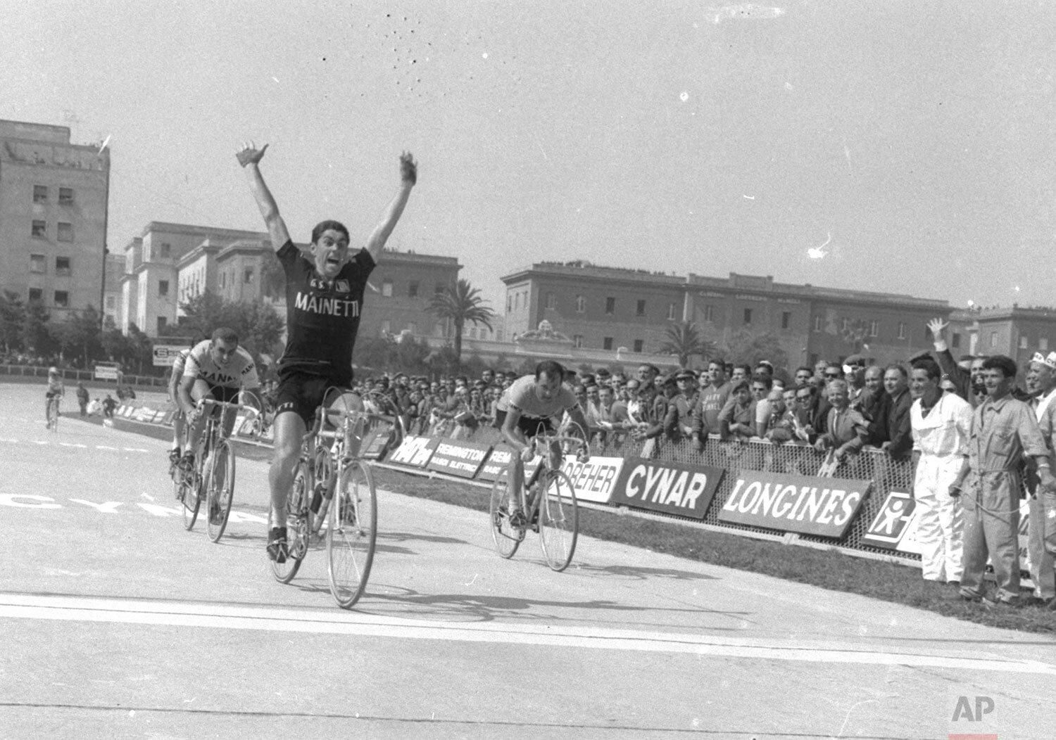  Marino Basso of Italy raises his arms as he passes the finish line to win the May 25,1966 eighth leg of the Tour of Italy bicycle race, the 238 kilometer downhill leg from Rocca de Cambio in the Appennines to Naples.  (AP Photo) 