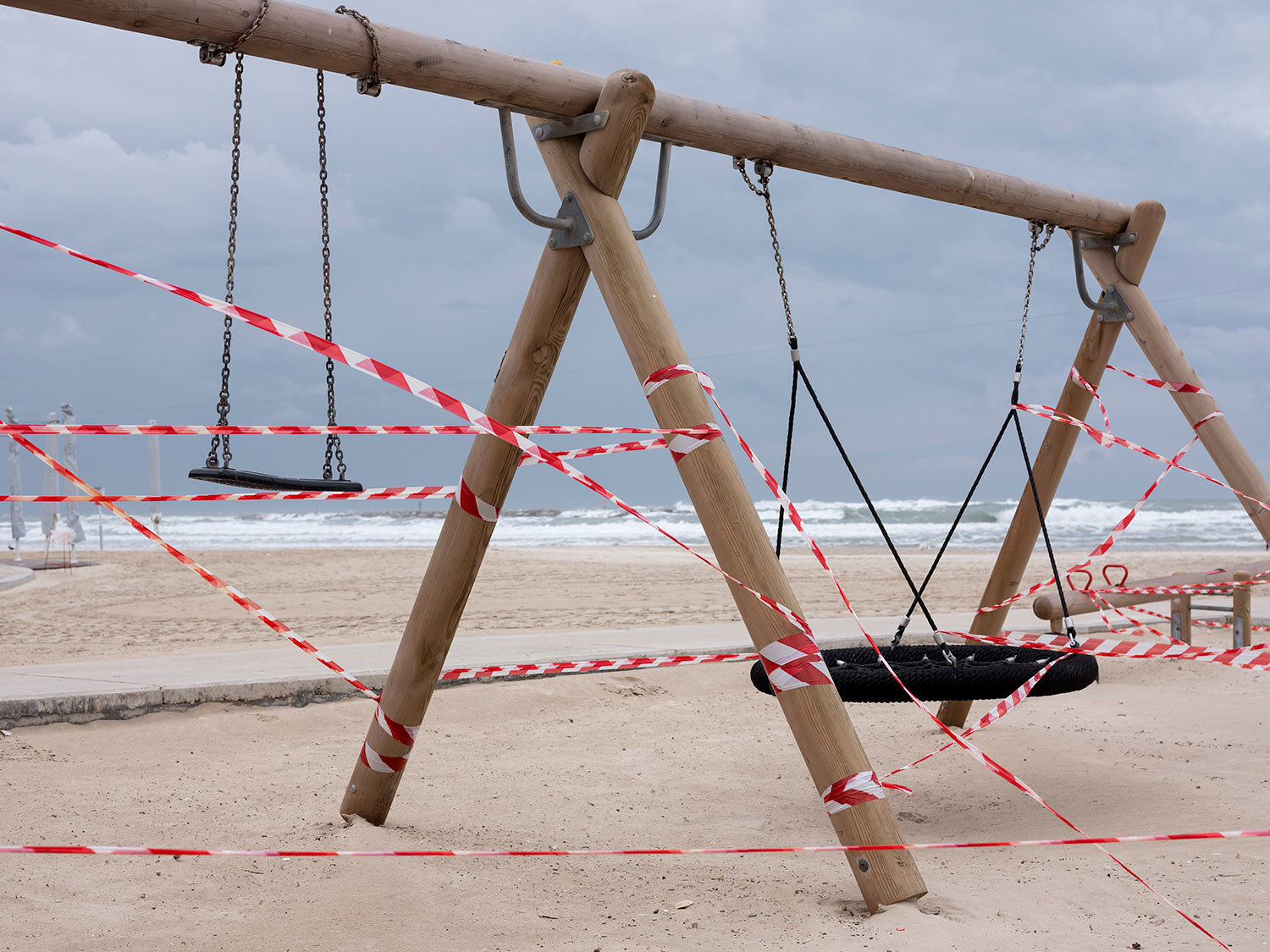  This Friday, March 20, 2020 photo shows swings at Tel Aviv's beachfront wrapped in tape to prevent public access. (AP Photo/Oded Balilty) 