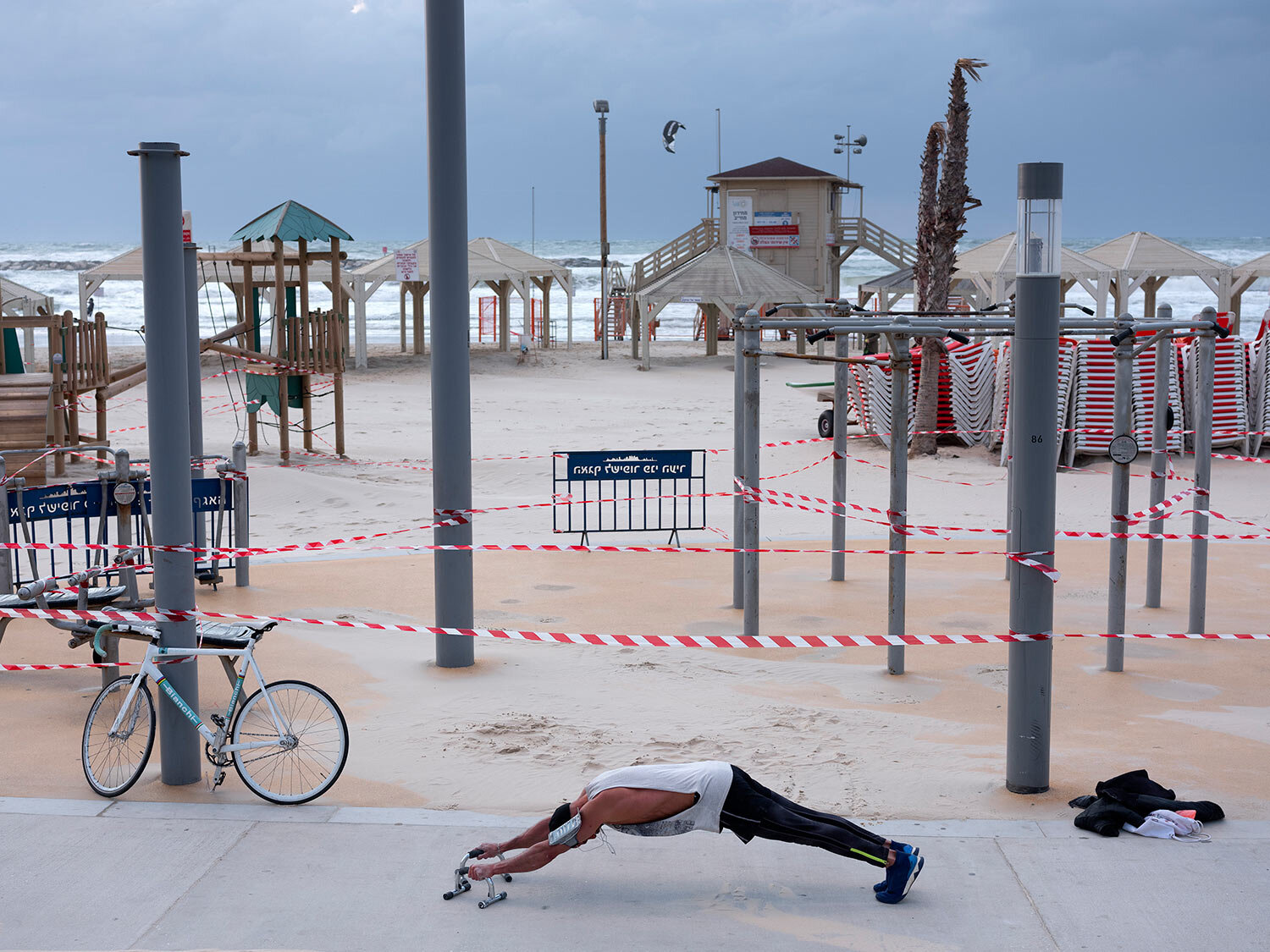  This Thursday, March 19, 2020 photo shows a free gym at Tel Aviv's beachfront wrapped in tape to prevent public access. (AP Photo/Oded Balilty) 