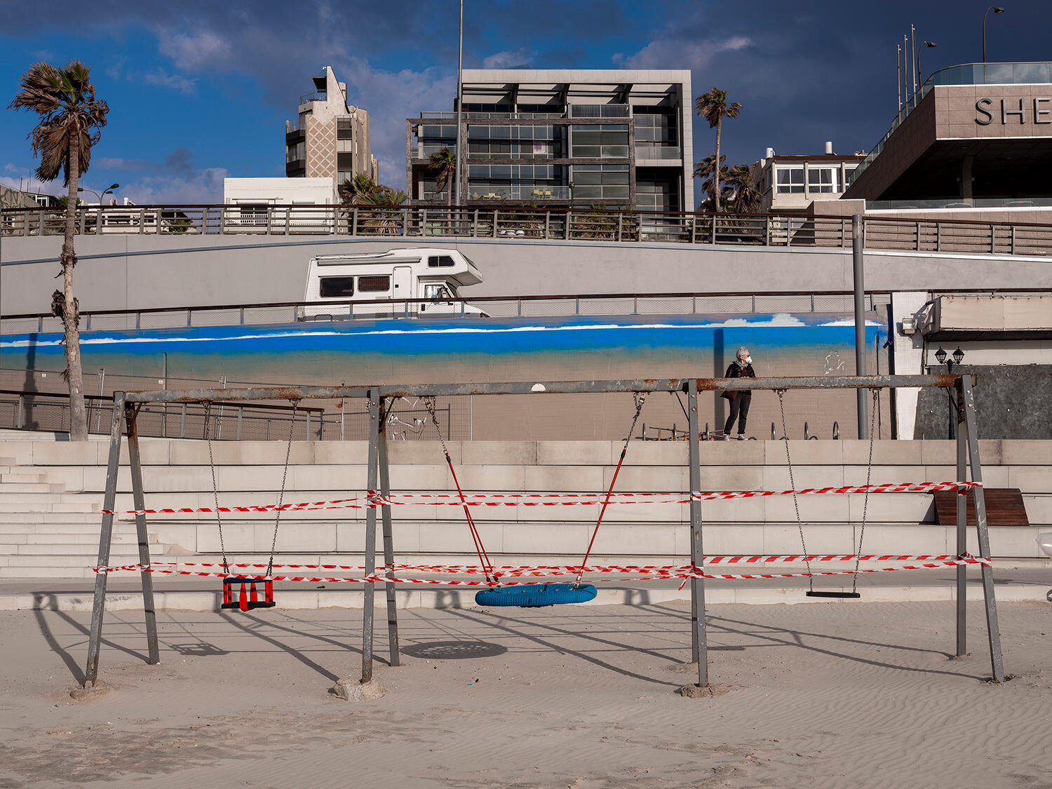  This Thursday, March 19, 2020 photo shows swings at Tel Aviv's beachfront wrapped in tape to prevent public access. (AP Photo/Oded Balilty) 