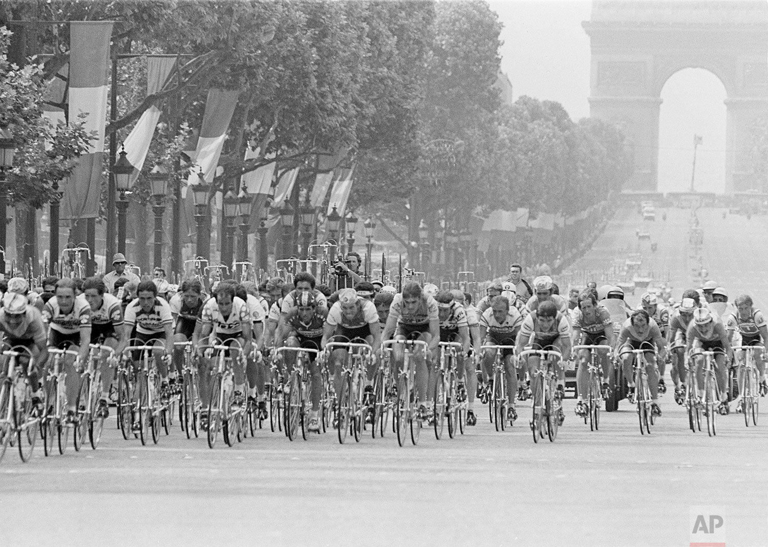  The competitors of the 71st Tour de France cycling race speed down the Champs Elysees during the 23rd and last leg of the Tour de France in Paris, July 22, 1984. French champion Laurent Fignon won the 1984 edition of the famous cycling race. (AP Pho