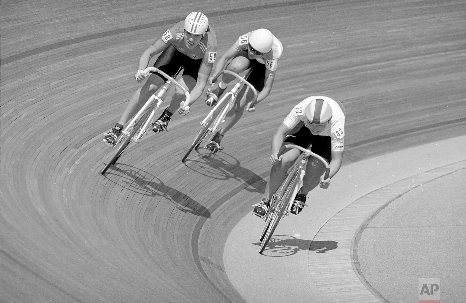  Isabelle Gautheron, left, of France, powers past Elisabetta Fanton, center, of Italy and Seiko Hashimoto, right, of Japan, on her way to victory in the Women's Sprint 1/8 finals of the Olympic Cycling competition in  Seoul, South Korea, Sept. 21, 19