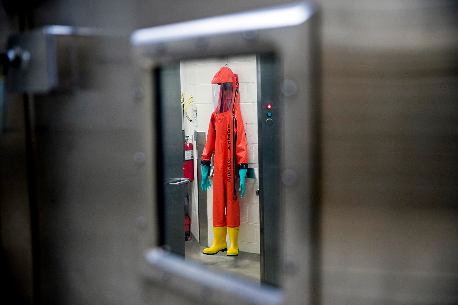  A biosafety protective suit for handling viral diseases are hung up in a biosafety level 4 training facility at U.S. Army Medical Research and Development Command at Fort Detrick in Frederick, Md., March 19, 2020, where scientists are working to hel