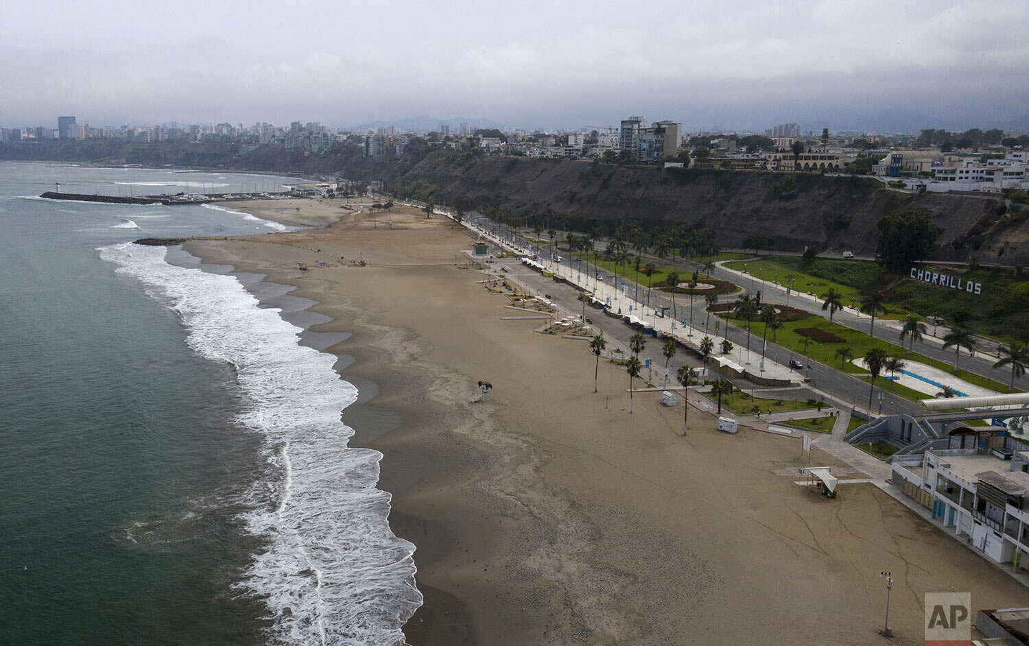  An aerial view of Agua Dulce beach is seen absent of beachgoers in the final days of the Southern Hemisphere summer, in Lima, Peru, March 25, 2020. (AP Photo/Rodrigo Abd) 