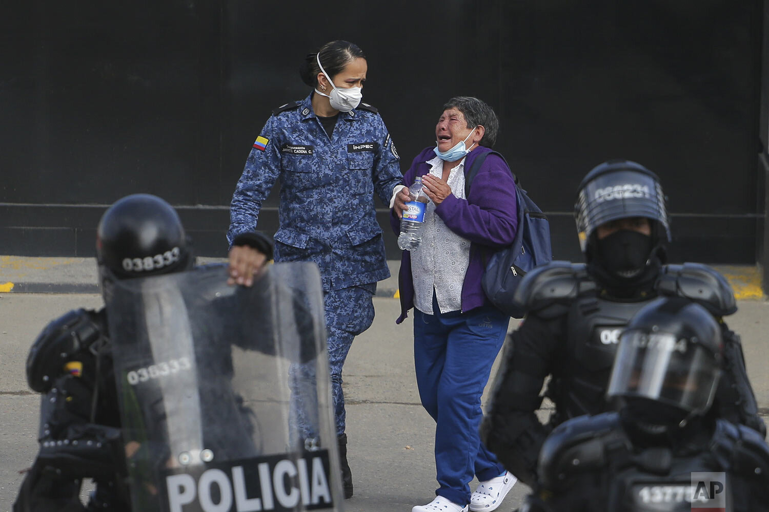  The relative of an inmate cries outside La Modelo jail in Bogota, Colombia, March 22, 2020. Violence broke out in the prison out of inmates' fears that authorities are not doing enough to prevent coronavirus inside overcrowded prisons. (AP Photo/Iva