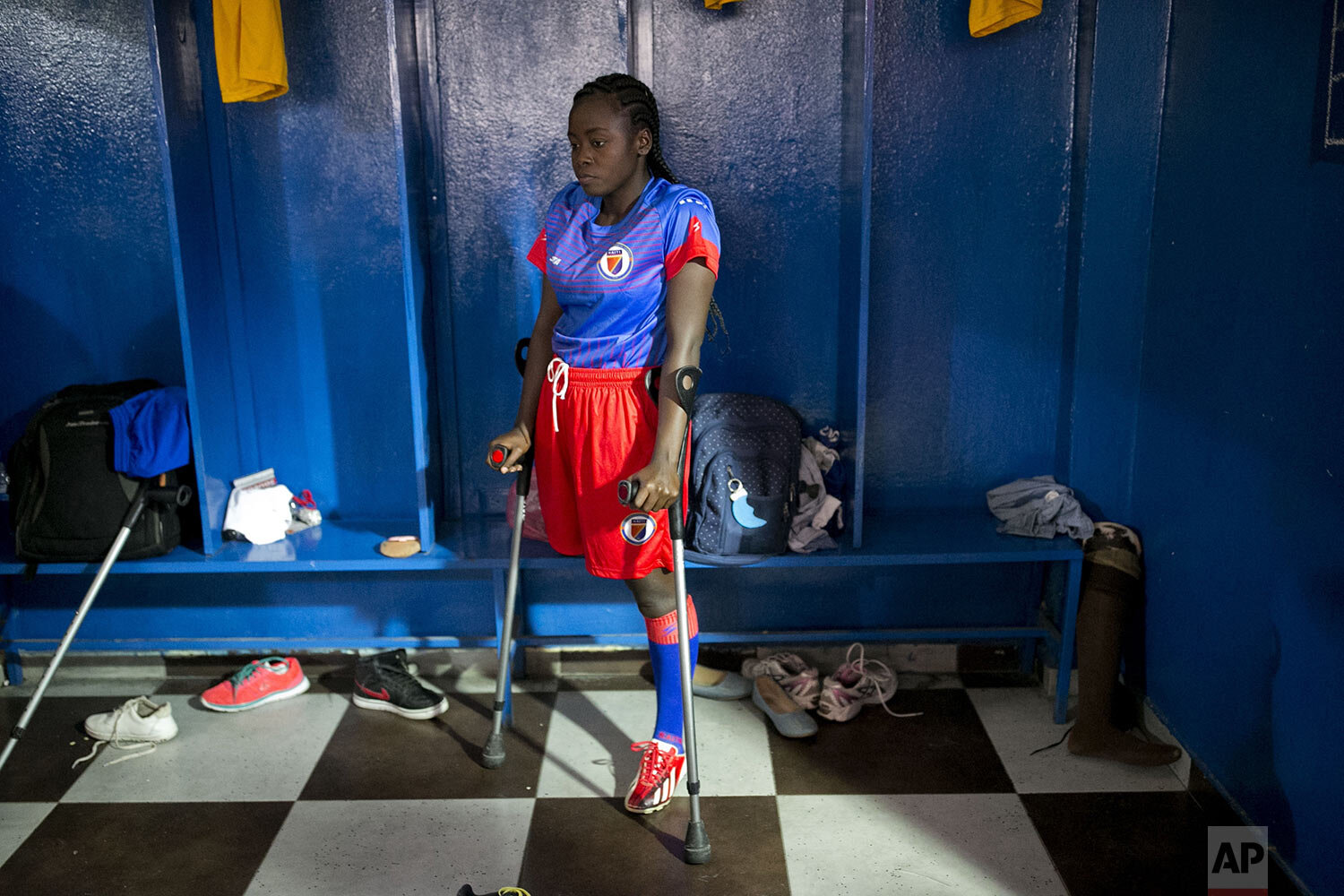  A player on Haiti's amputee women's soccer team gets lost in thought before the start of a match with the Dominican Republic, to mark International Women's Day, in the Petion-Ville suburb of Port-au-Prince, Haiti, March 8, 2020. Haiti won 2-0. (AP P