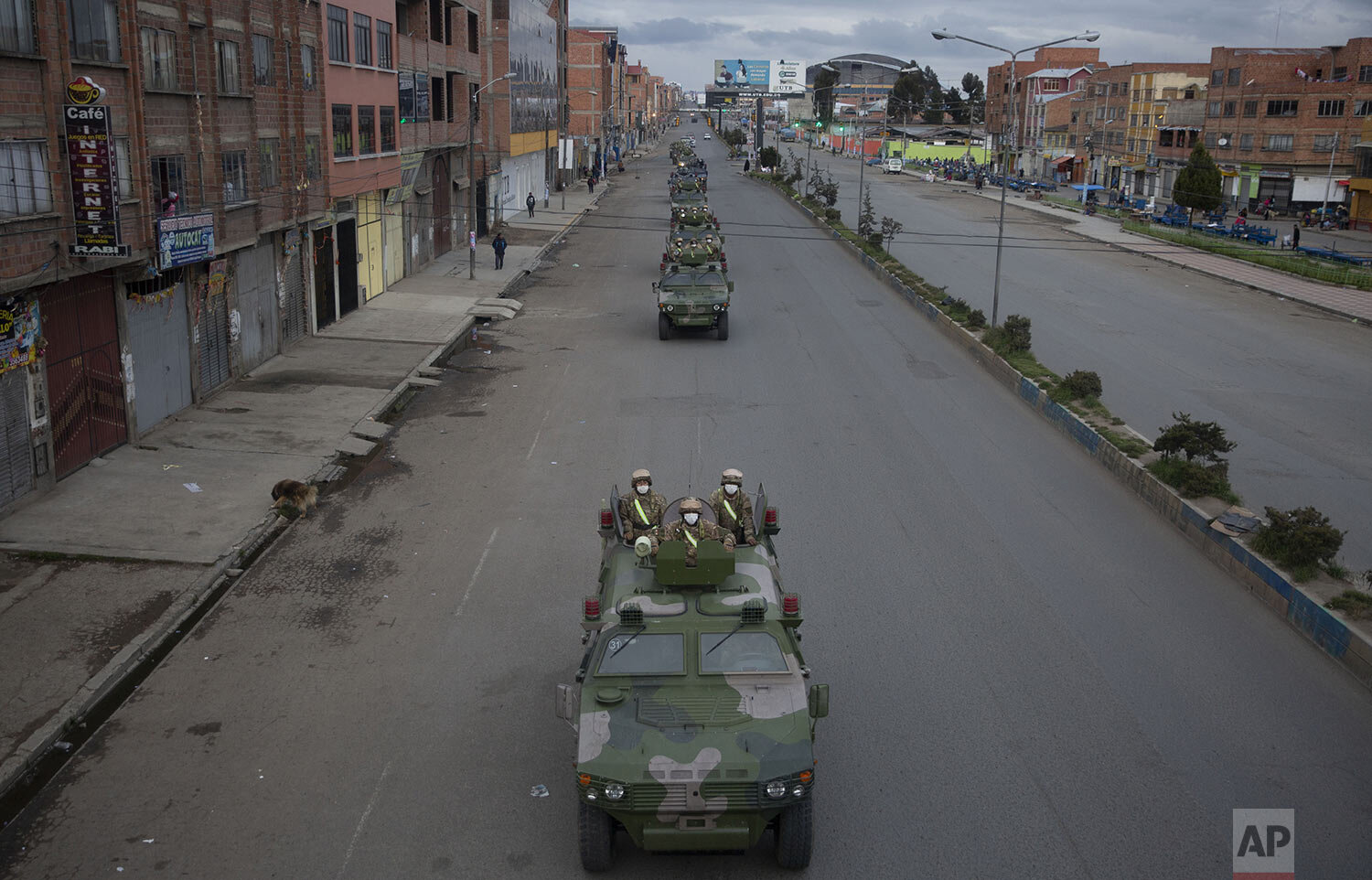  Military armored vehicles patrol El Alto, Bolivia, March 20, 2020, during a quarantine from 5pm to 5am in an attempt to stop the spread of the new coronavirus. (AP Photo/Juan Karita) 