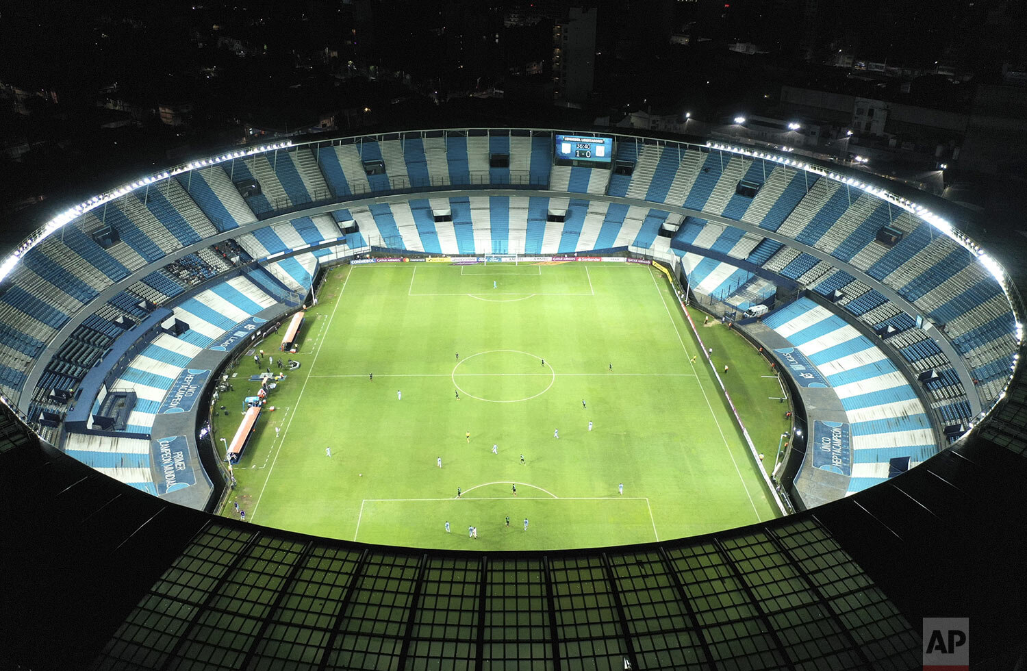  Peru's Alianza Lima and Argentina's Racing Club play a Copa Libertadores soccer match in an empty Presidente Peron stadium in Buenos Aires, Argentina, March 12, 2020, closed to fans to help contain the spread of the new coronavirus. (AP Photo/Gustav