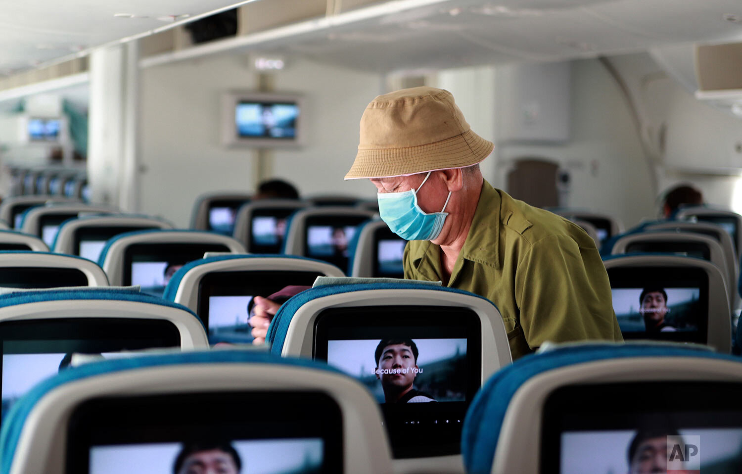  A man boards a plane in Ho Chi Minh City, Vietnam on Monday, March 16, 2020. (AP Photo/Hau Dinh) 