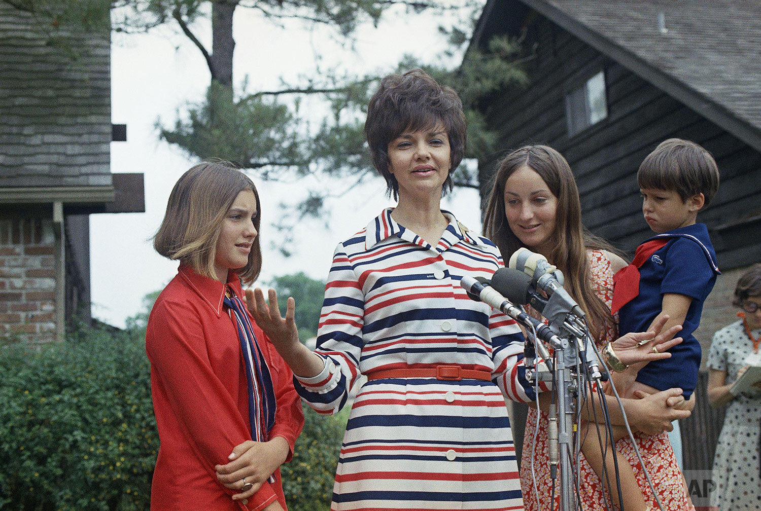  Marilyn Lovell is shown with her with children, from left, Susan, Barbara and Jeffrey, as she speaks to the media after her husband Jim Lovell's safe splashdown in Apollo 13 following its aborted lunar landing mission, April 17, 1970. (AP Photo) 