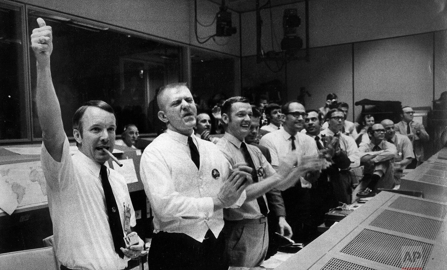  The four Apollo 13 flight crew directors who brought the crippled spacecraft back to Earth celebrate at their post in Mission Control at the Manned Spacecraft Center, Houston as they learn of the command module's successful splashdown April 17, 1970