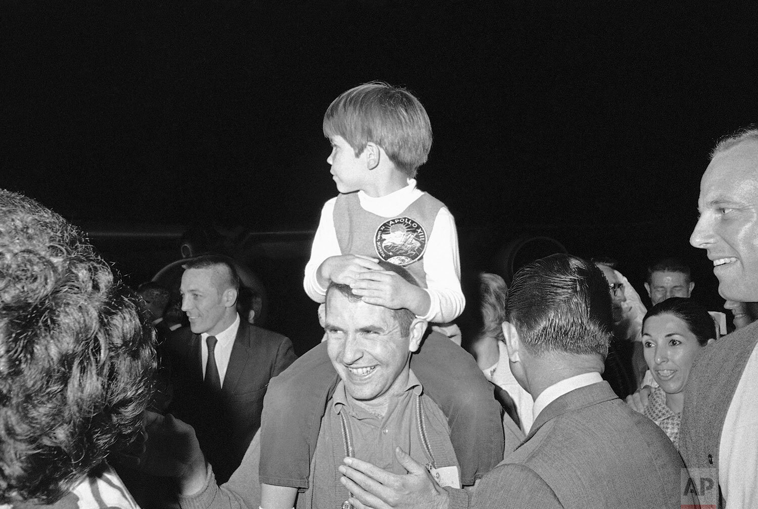  Apollo 13 Astronaut James Lovell Jr., holds his son, Jeff Lovell, 4, as he arrived back to Ellington Air Force Base, April 19, 1970, Houston, Tex. (AP Photo) 