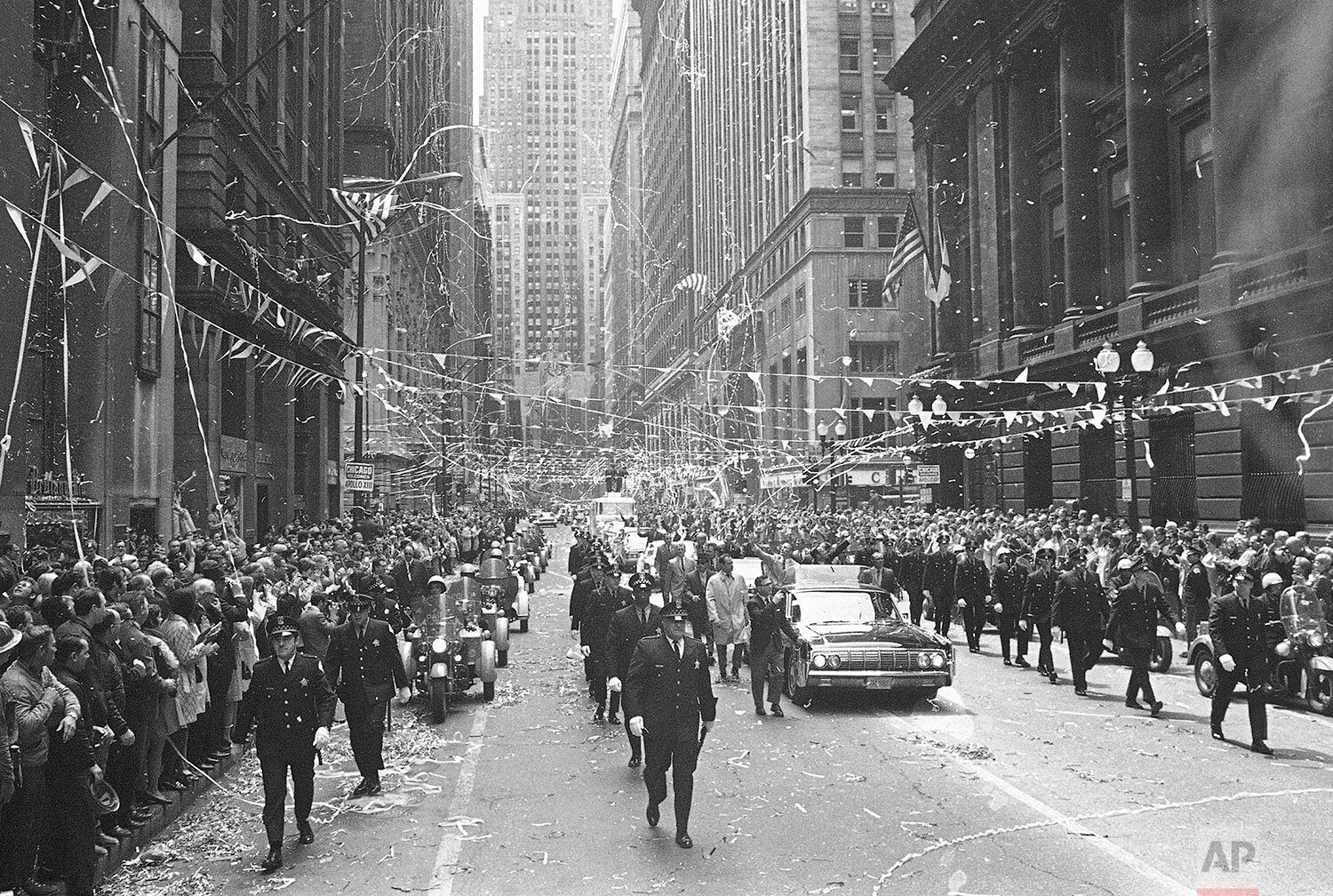  Confetti pours from the skyscrapers in Chicago’s financial district, May 1, 1970 as Apollo 13 astronauts John Swigert Jr., and James Lovell ride in a motorcade during a parade in their honor. (AP Photo) 