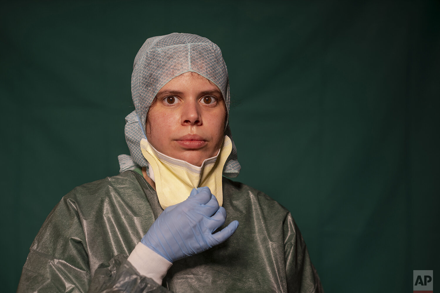  Claudia Accardo, ICU transport service at Rome's COVID 3 Spoke Casalpalocco Clinic, poses for a portrait, Friday, March 27, 2020, during a break in her daily shift. The intensive care doctors and nurses on the front lines of the coronavirus pandemic