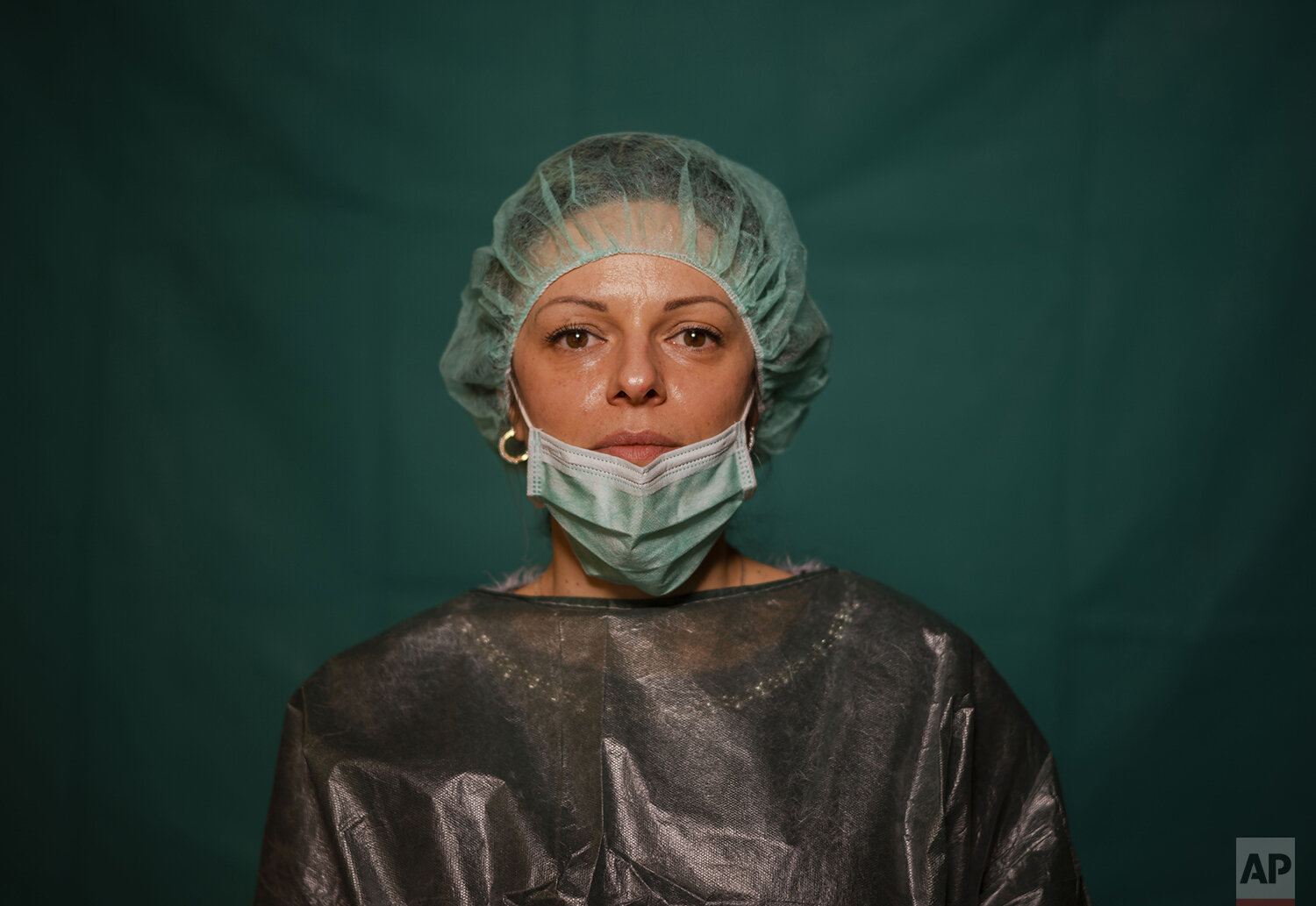  Laura Orsini, 39, an administrative worker at Rome's COVID 3 Spoke Casalpalocco Clinic poses for a portrait, Friday, March 27, 2020, during a break in her daily shift. The intensive care doctors and nurses on the front lines of the coronavirus pande
