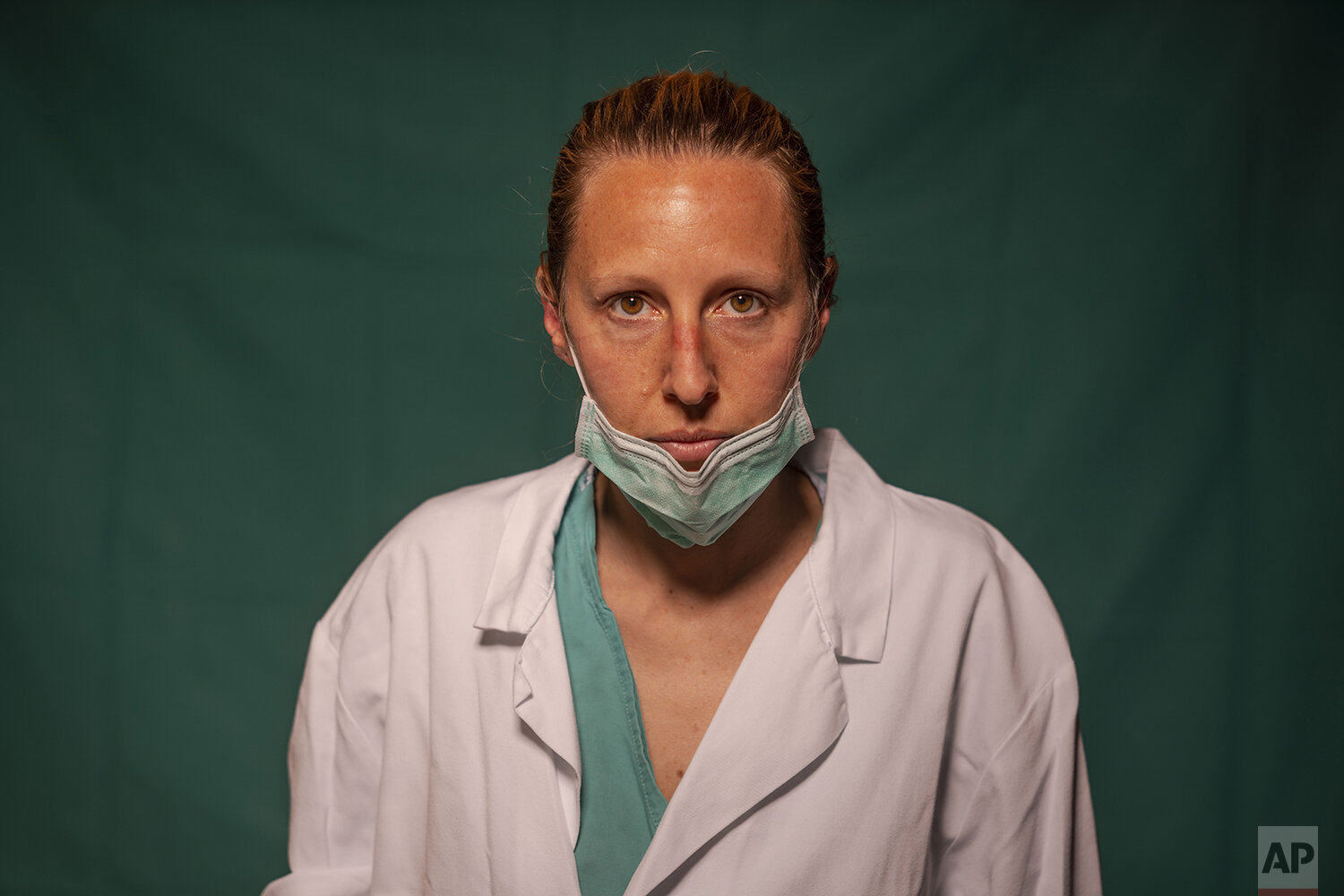  Doctor Marta Catoni, 33, an immunologist at Rome's COVID 3 Spoke Casalpalocco Clinic, poses for a portrait, Friday, March 27, 2020, during a break in her daily shift. The doctors and nurses on the front lines of the coronavirus pandemic in Italy are