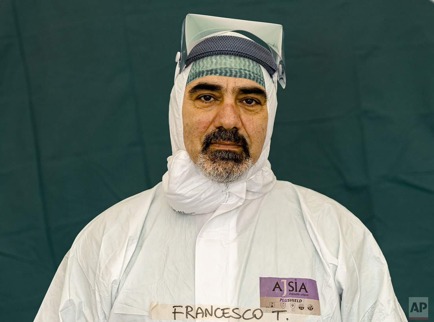  Francesco Tarantini, 54, a nurse at the emergency structures that were set up to ease procedures for the arrival of Covid-19 patients, poses for a portrait at the Brescia Spedali Civili Hospital, in Brescia, Italy Friday, March 27, 2020. (AP Photo/L