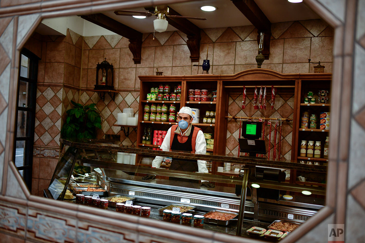  Butcher Jose Mari Armendariz poses at his store in Pamplona, northern Spain. (AP Photo/Alvaro Barrientos) 